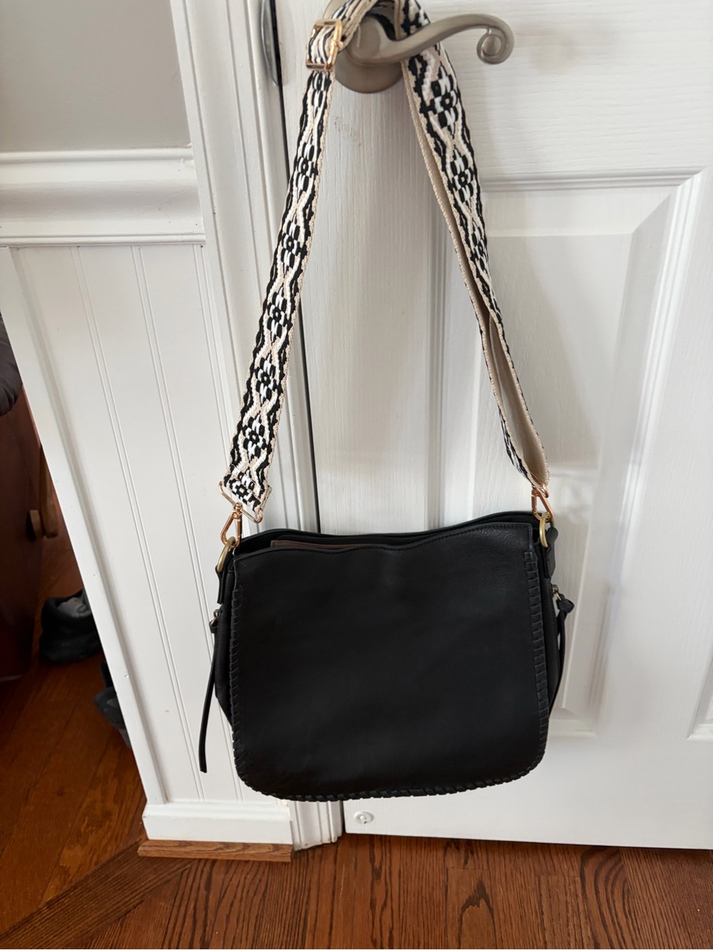 Jen & Company Black Crossbody with decorative guitar strap.